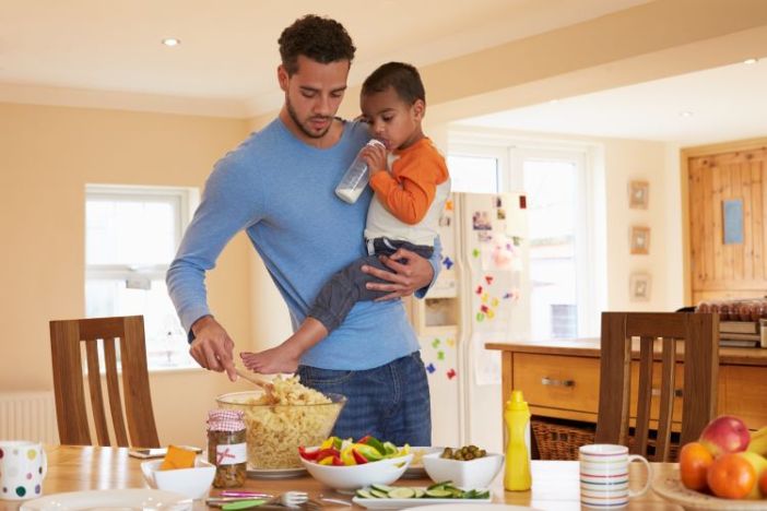 at-home dad carrying child
