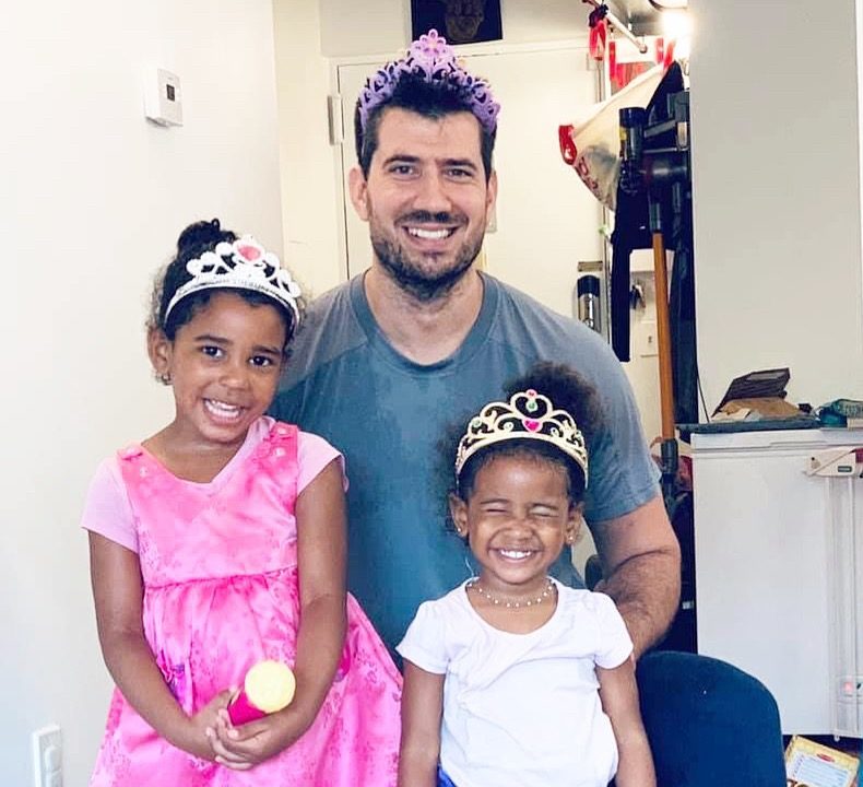 father with two kids dressed as princesses