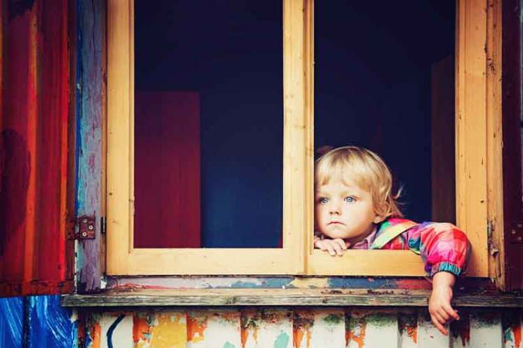 child looking out window