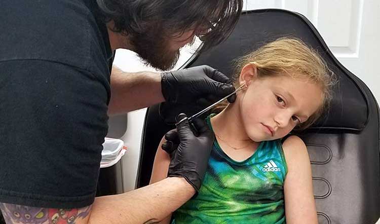 girl get ears pierced