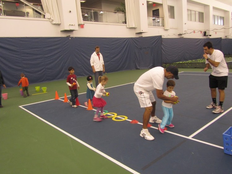 kids learn tennis at National Tennis Center