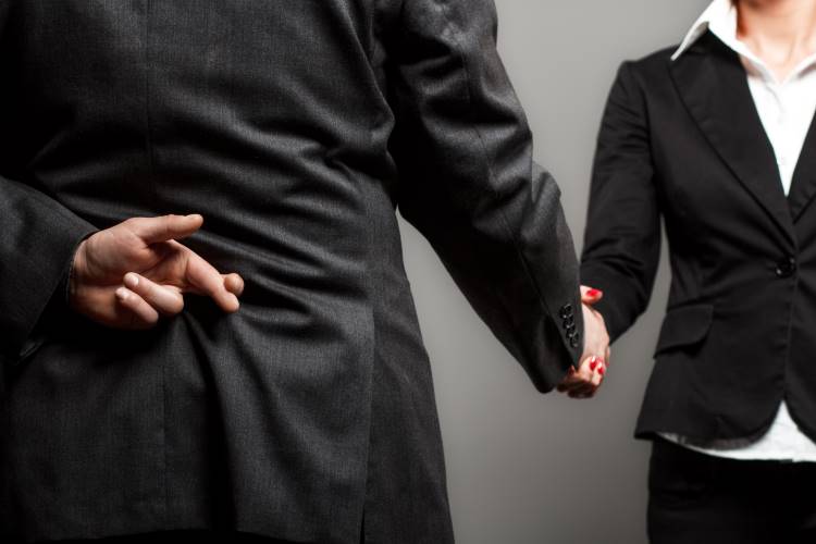integrity finger crossed behind back shaking hands