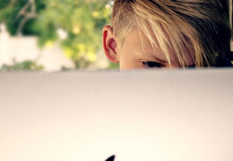 child at computer on social media